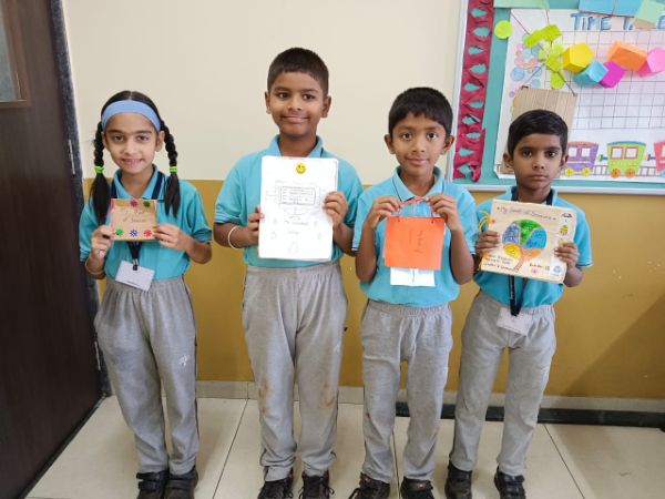 Students engaged in an activity to make My book of season - 2023 - pathardi
